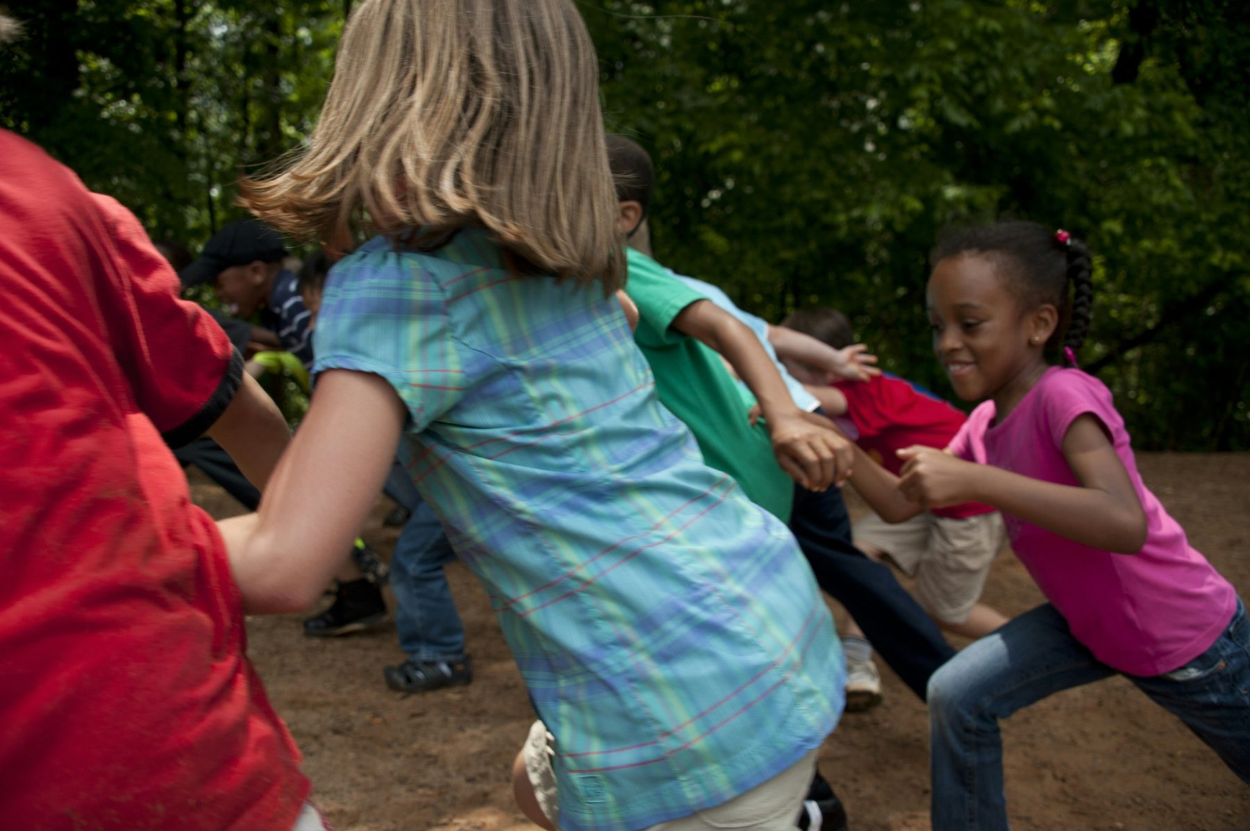 Children playing and moving together outdoors